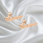 Minimalist personalized jewelry showing custom name stud on ear.