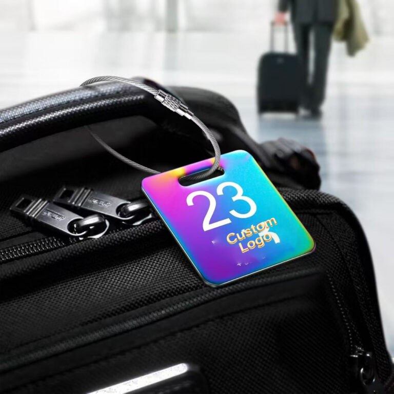 Custom metal luggage tag with gradient rainbow finish and stainless steel wire loop.