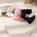 custom metal logo badge on scrunchie hair accessory