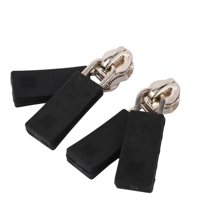 Set of matte black rectangular double sided zipper sliders with silver metal hardware.