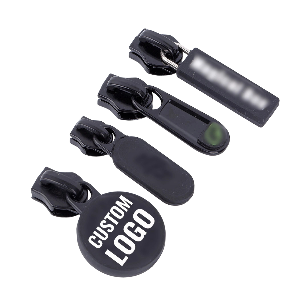 A collection of black double sided zipper sliders including round and rectangular shapes for custom gear.