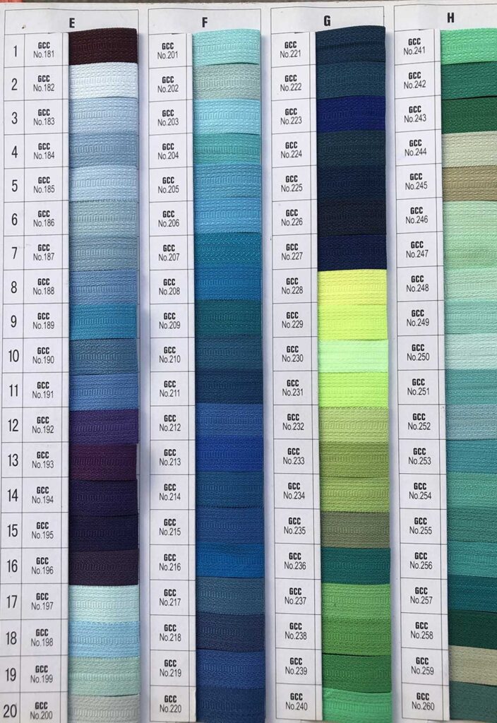 B2B supplier zipper tape color swatch card 2 for rainbow nylon coil zipper by the yard customization featuring blue, green, and dark shades.