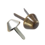 Close up of vintage antique brass Metal Cone Brads with durable double prongs for bags.