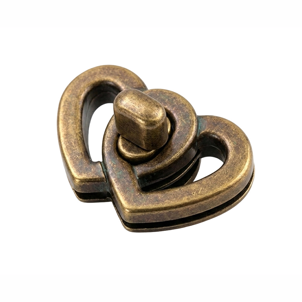 Antique brass purse twist lock with heavy duty turn lock mechanism for vintage leather goods.