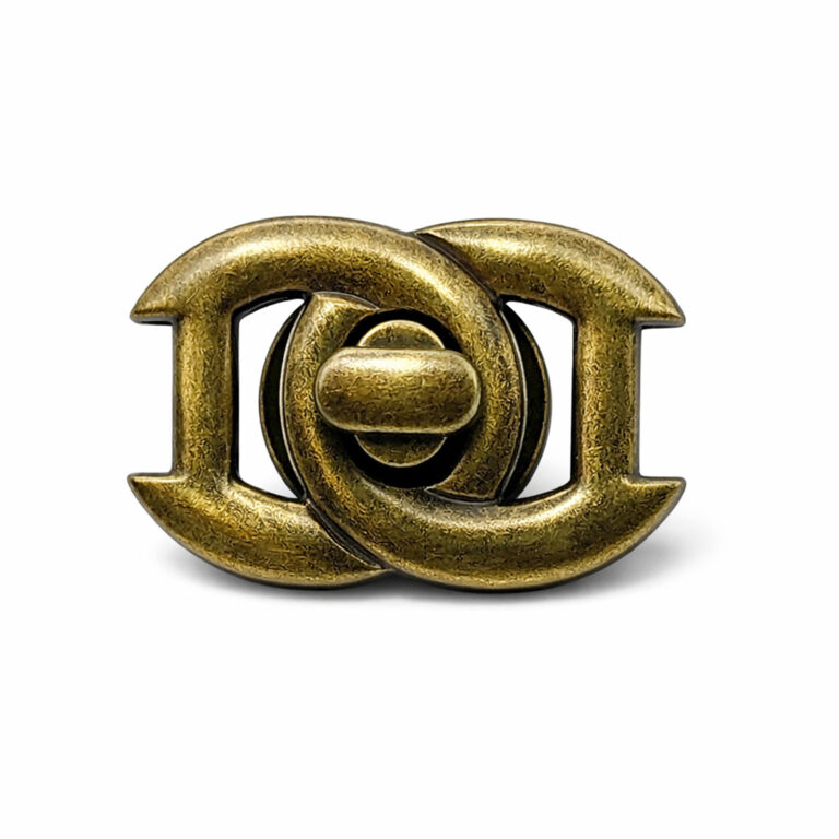 Front view of a premium zinc alloy metal turn lock for bags with an elegant interlocking pattern design.