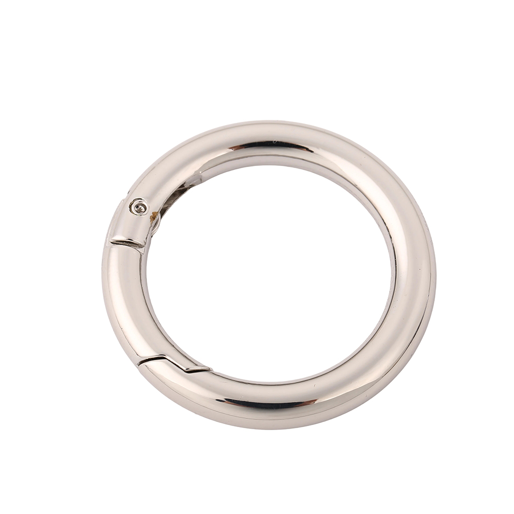 Durable metal spring ring fastener in a bright finish for purse hardware repair and strap attachment.