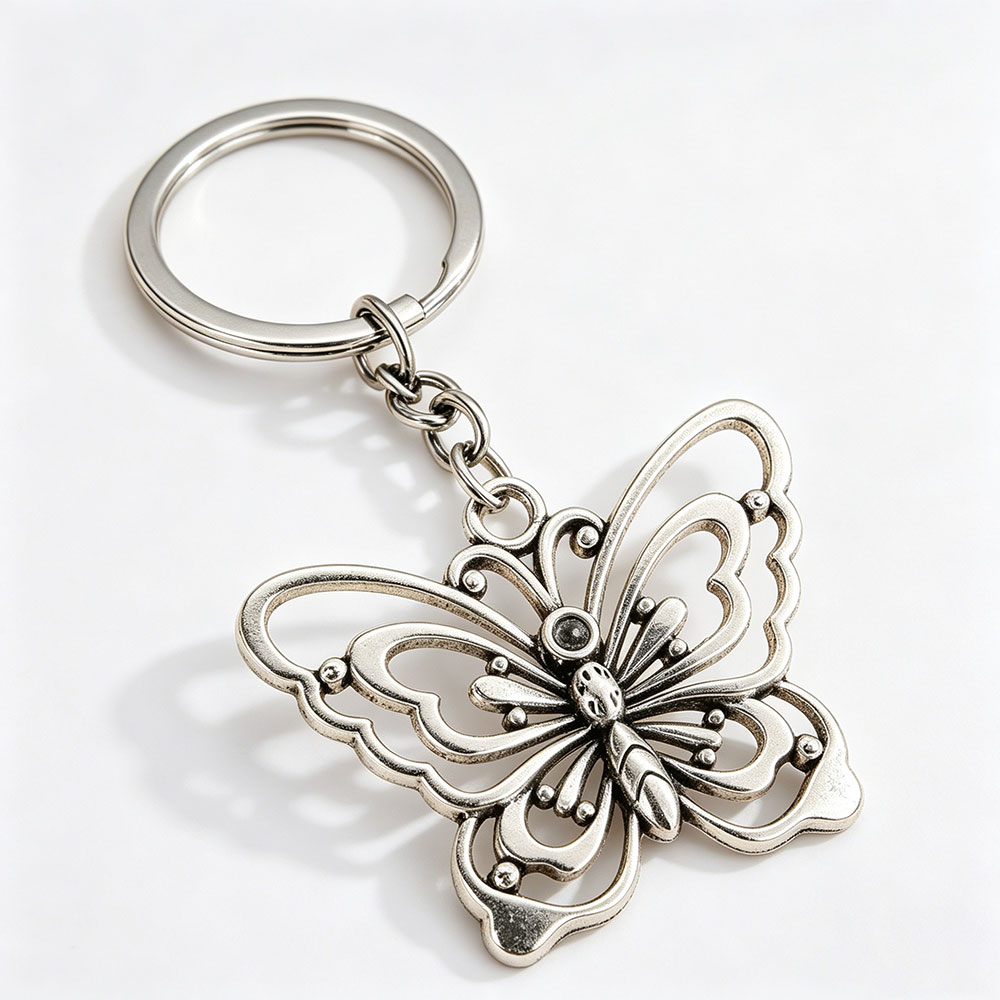 Close-up of a textured hollow butterfly bag ornament with durable split ring, engineered for high 48h salt spray testing performance.