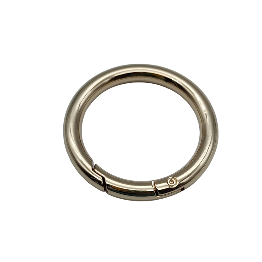 Premium gold finished circular bag strap connector and quick release round carabiner for designer purses.