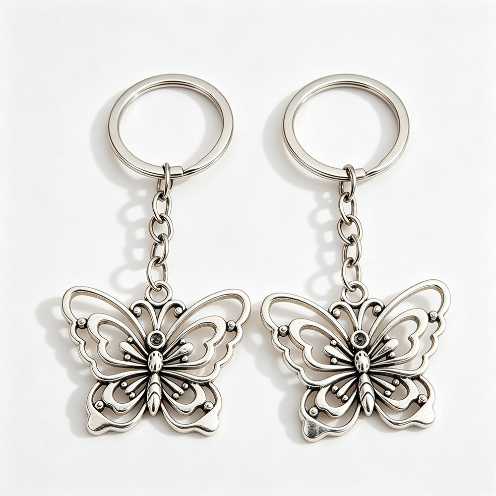 Wholesale butterfly purse charms equipped with classic split flat keyrings, manufactured by DG Buddy hardware.