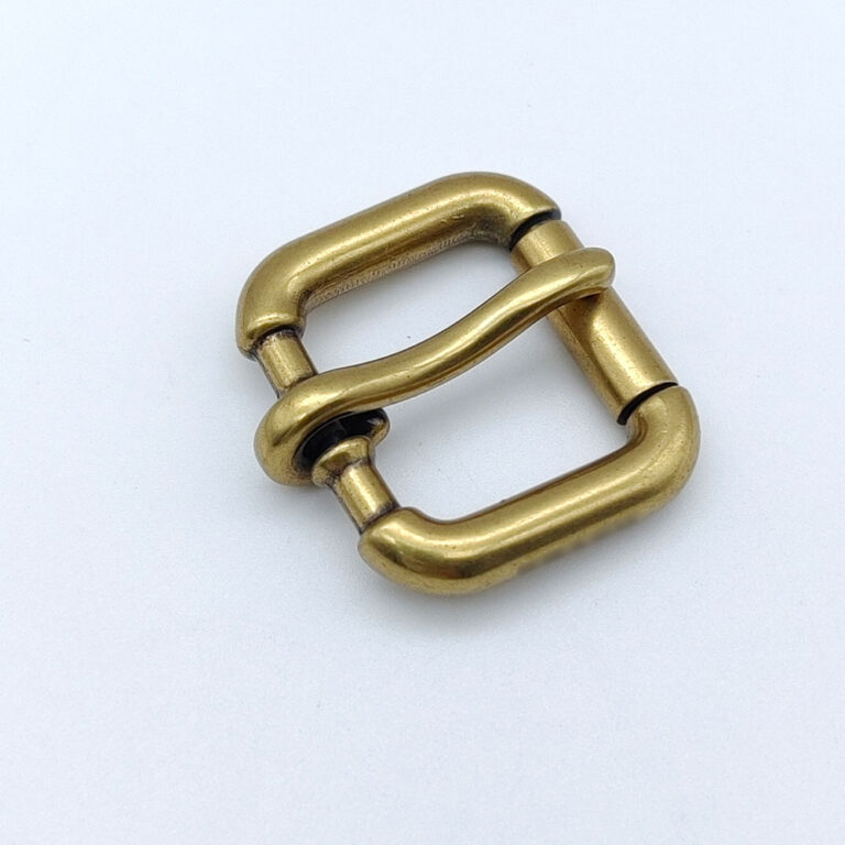 Antique brass solid brass roller buckle with a single prong for leather straps.