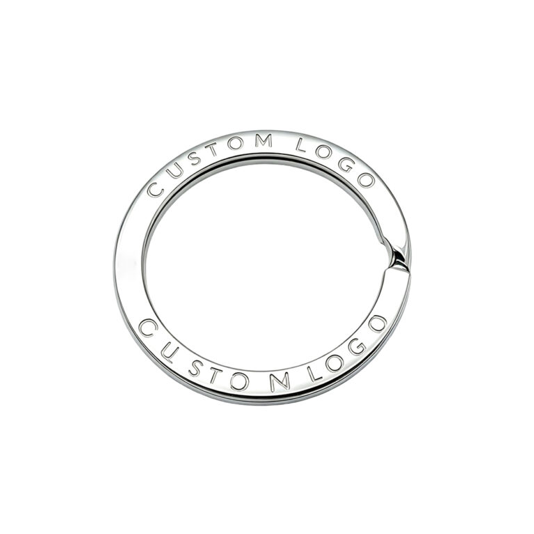 Custom engraved metal key ring featuring laser engraved logo hardware for luxury leather goods.