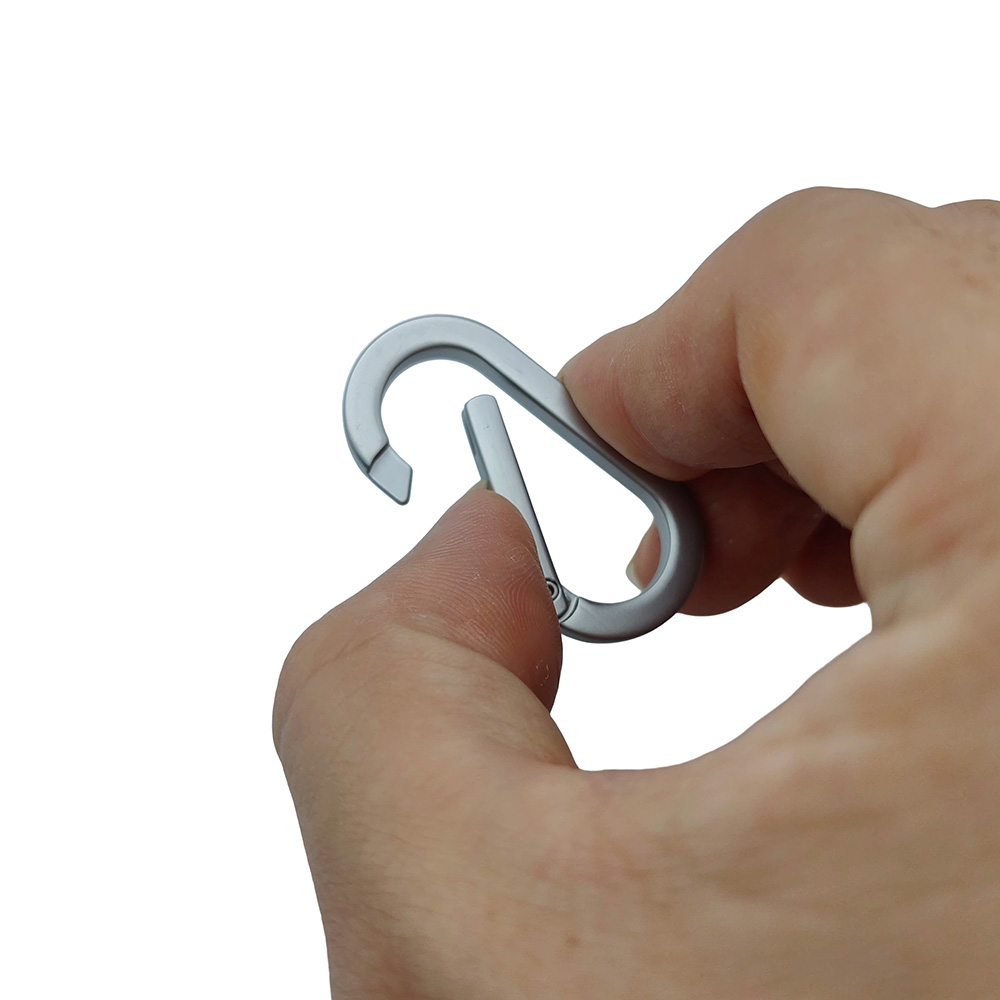 Showing the reliable push gate snap ring mechanism when opened, used for secure handbag chain connection.