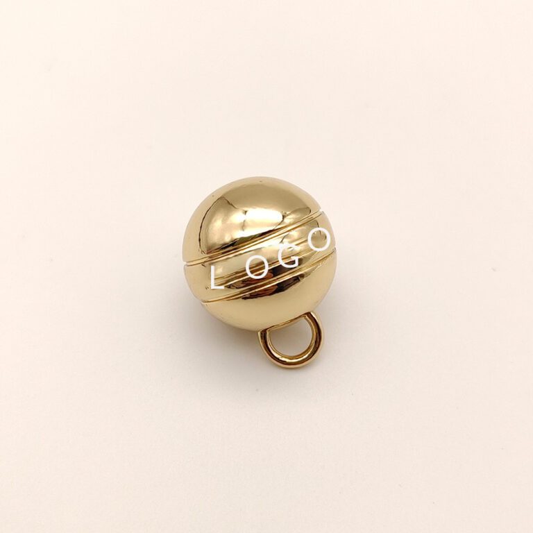 Polished round ball charm with jump ring connector in high quality gold plating.