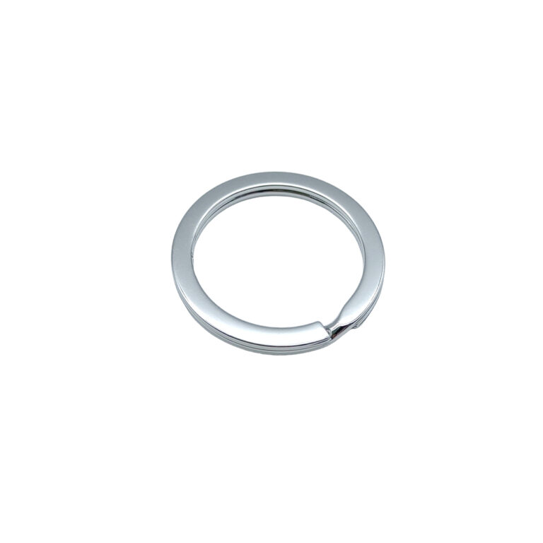 Custom engraved metal key ring featuring laser engraved logo hardware for luxury leather goods.