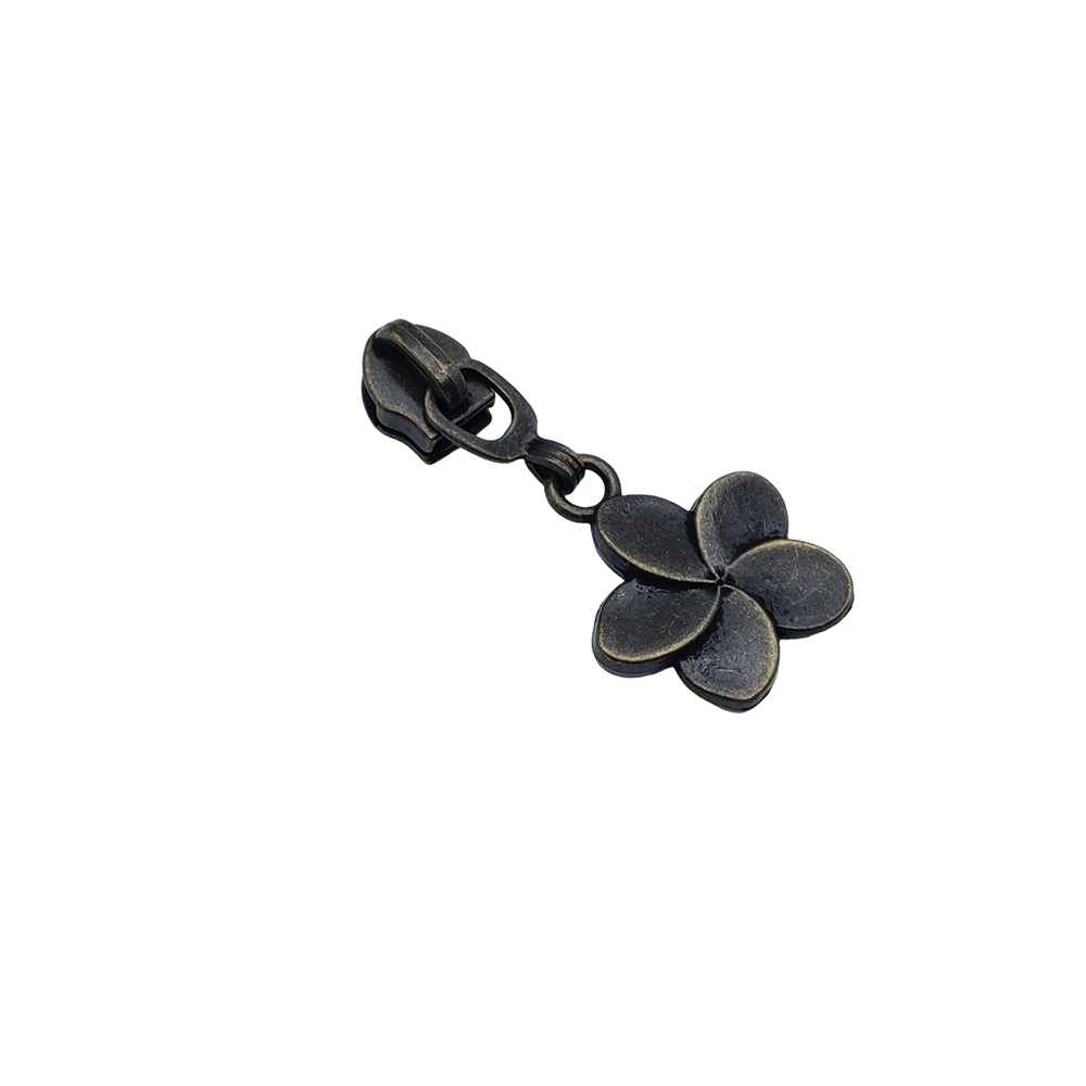 Dark flower zipper slider with articulated connector and four-petal pull tab for handbags