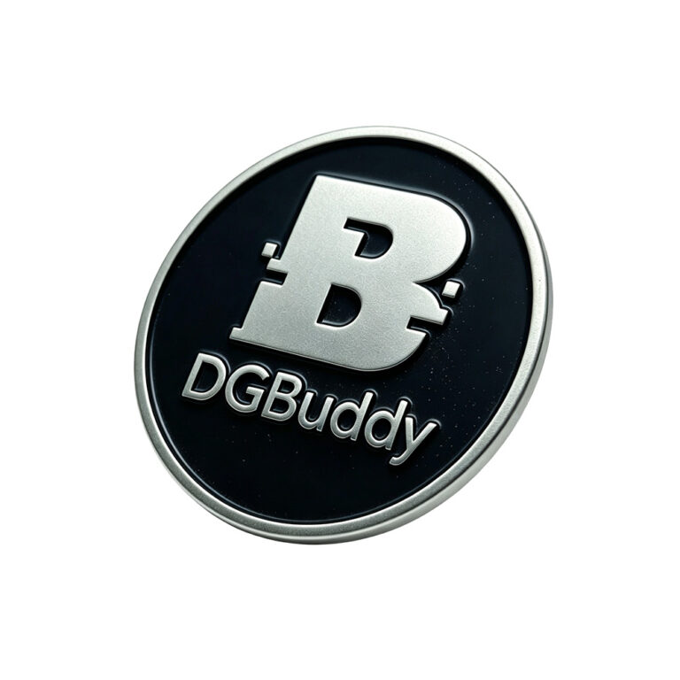 Round custom metal logo tag with raised silver logo and black background for handbags