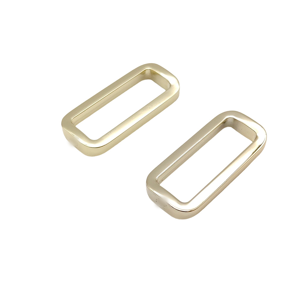 Pair of rectangular handbag buckles shown from an angled view