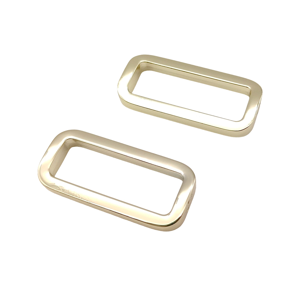 Two zinc alloy bag hardware buckles shown in perspective