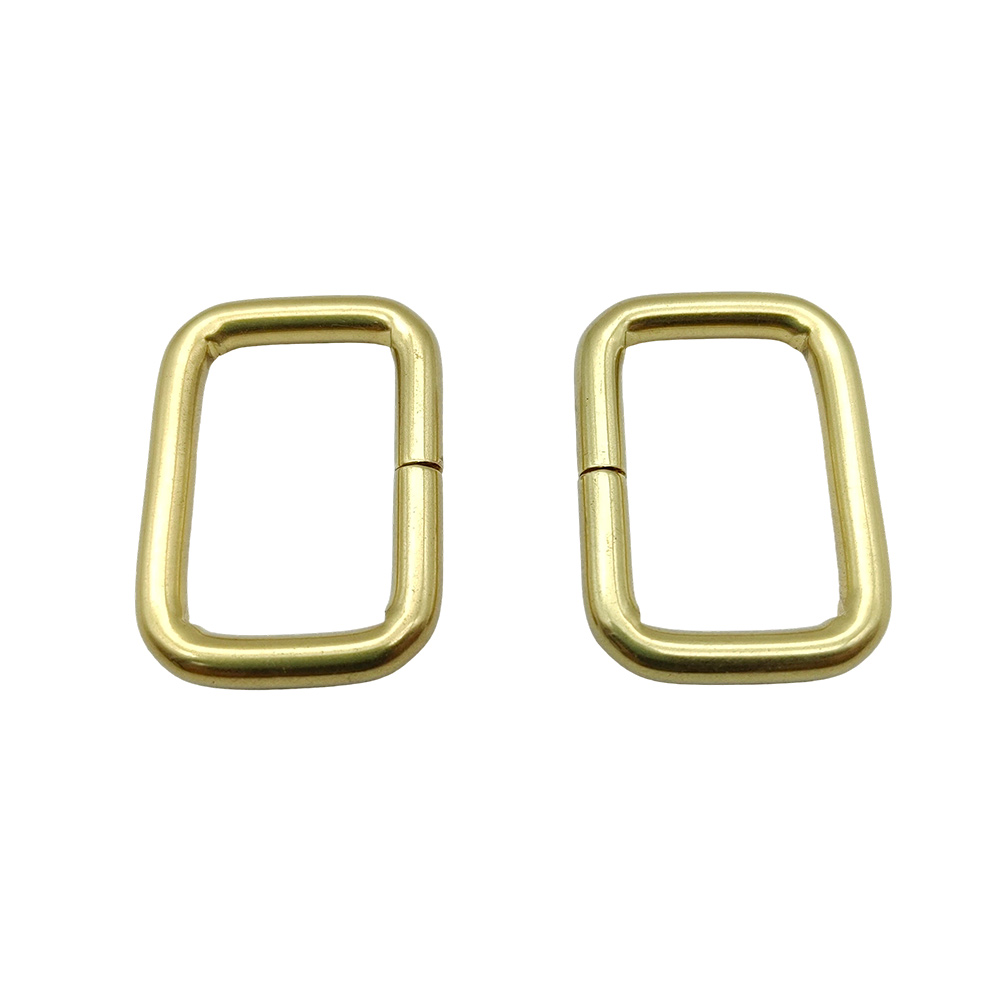 Side-by-side gold iron rectangle rings for size and finish comparison
