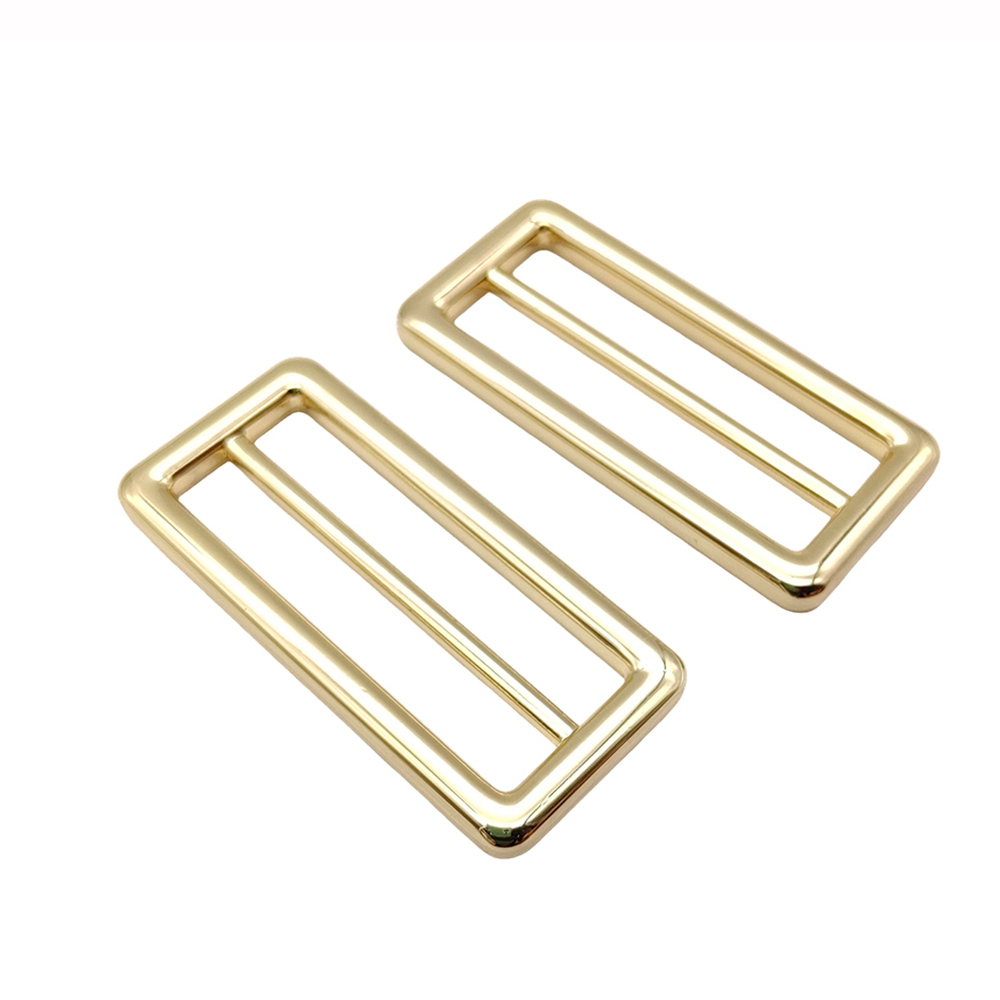 Metal triglide buckles in gold finish for custom handbag strap hardware