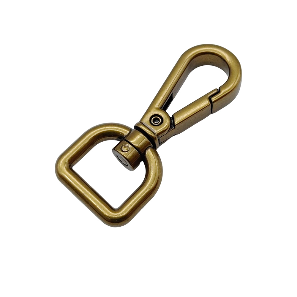 45-degree view of a brass swivel snap hook, focus on the rotating swivel joint