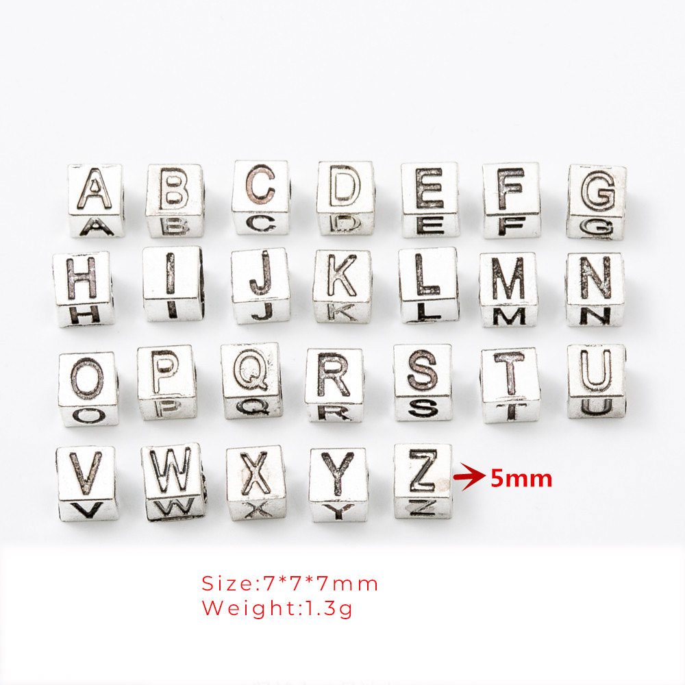 7mm letter beads showing approximately 5mm hole diameter and 1.3g weight