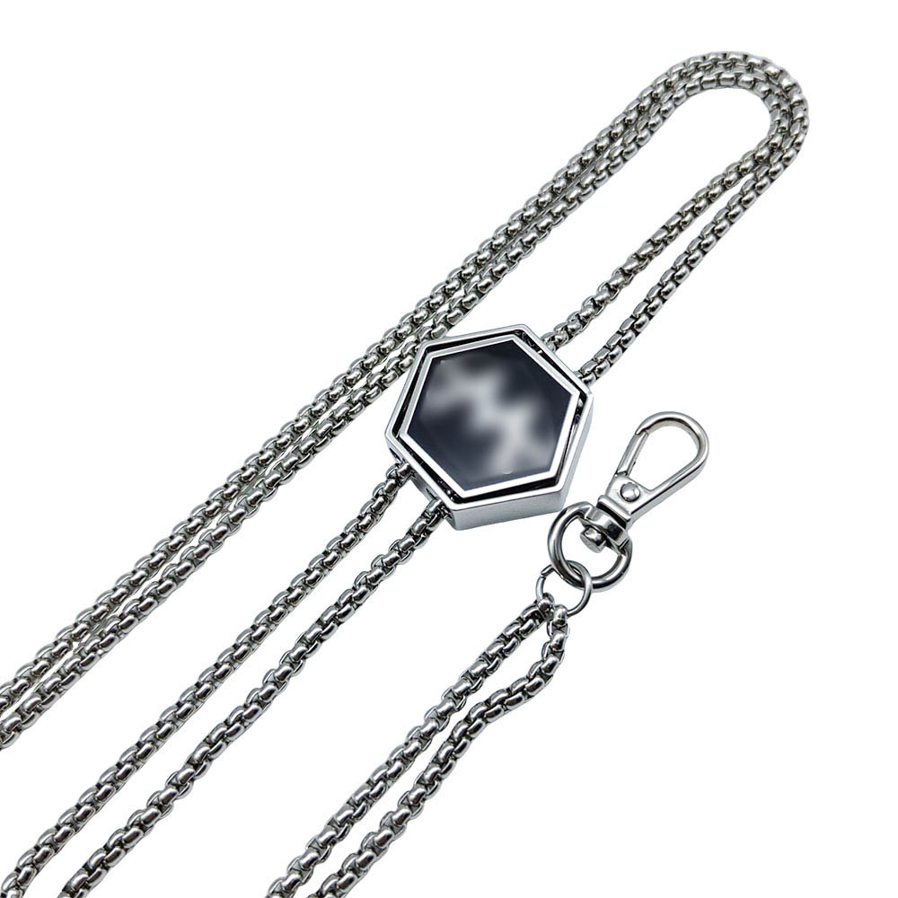 Silver box chain arranged around a geometric slider pendant with an end hook