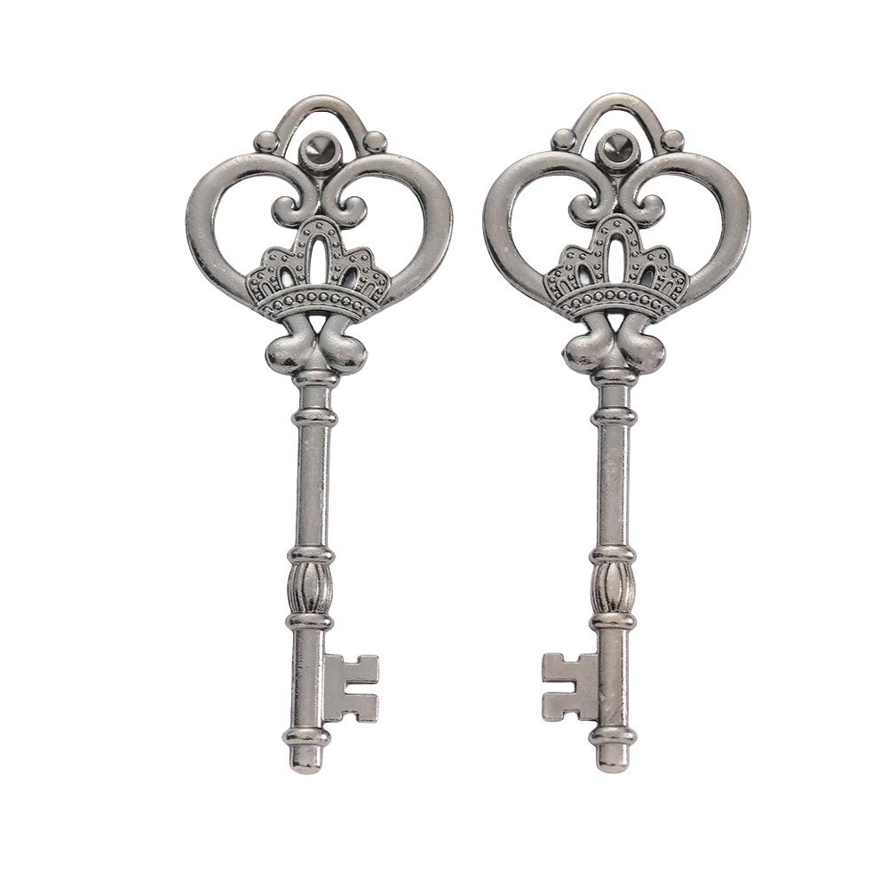 Pair of antique silver and gunmetal crown keys, zinc alloy, detailed shaft and bit