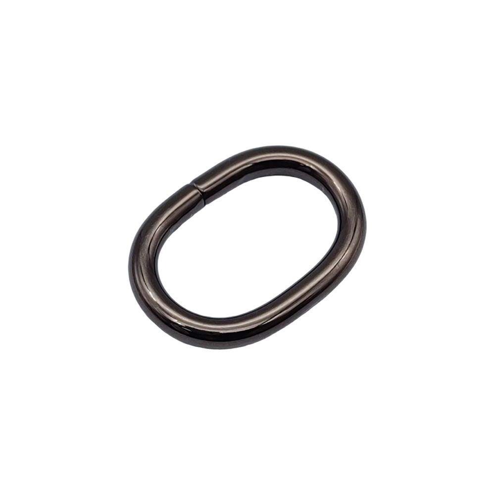 Diagonal view of a polished gunmetal oval ring with a smooth weld seam at the upper left