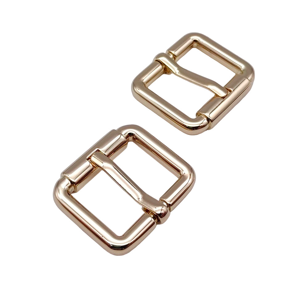 Stacked gold metal buckles showing multiple pieces of bag hardware