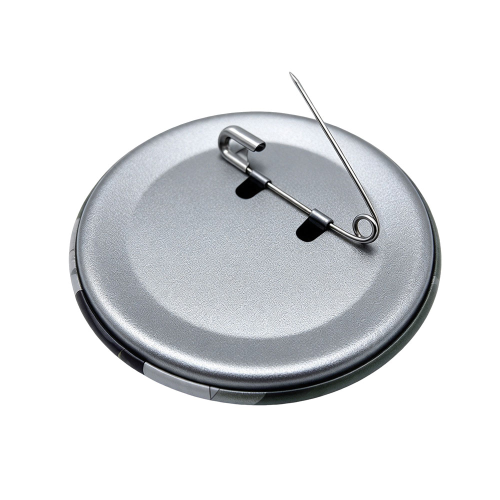 Back view of a metal pinback button pin showing the secure safety pin clasp