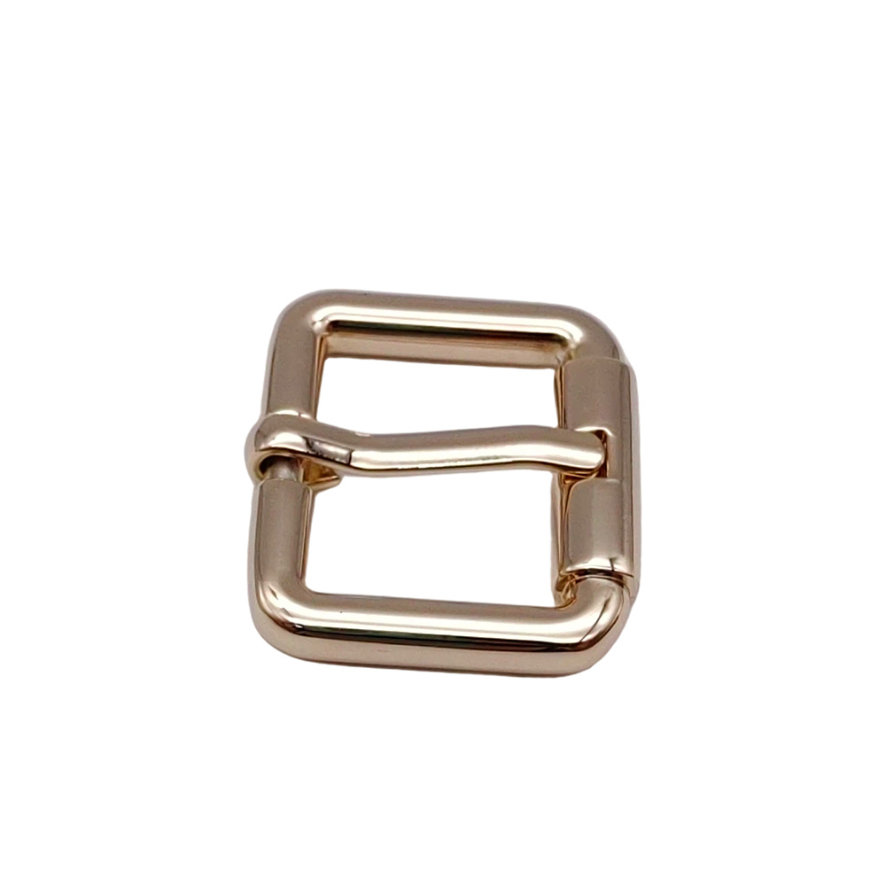 Close-up of pin buckle mechanism on gold square frame