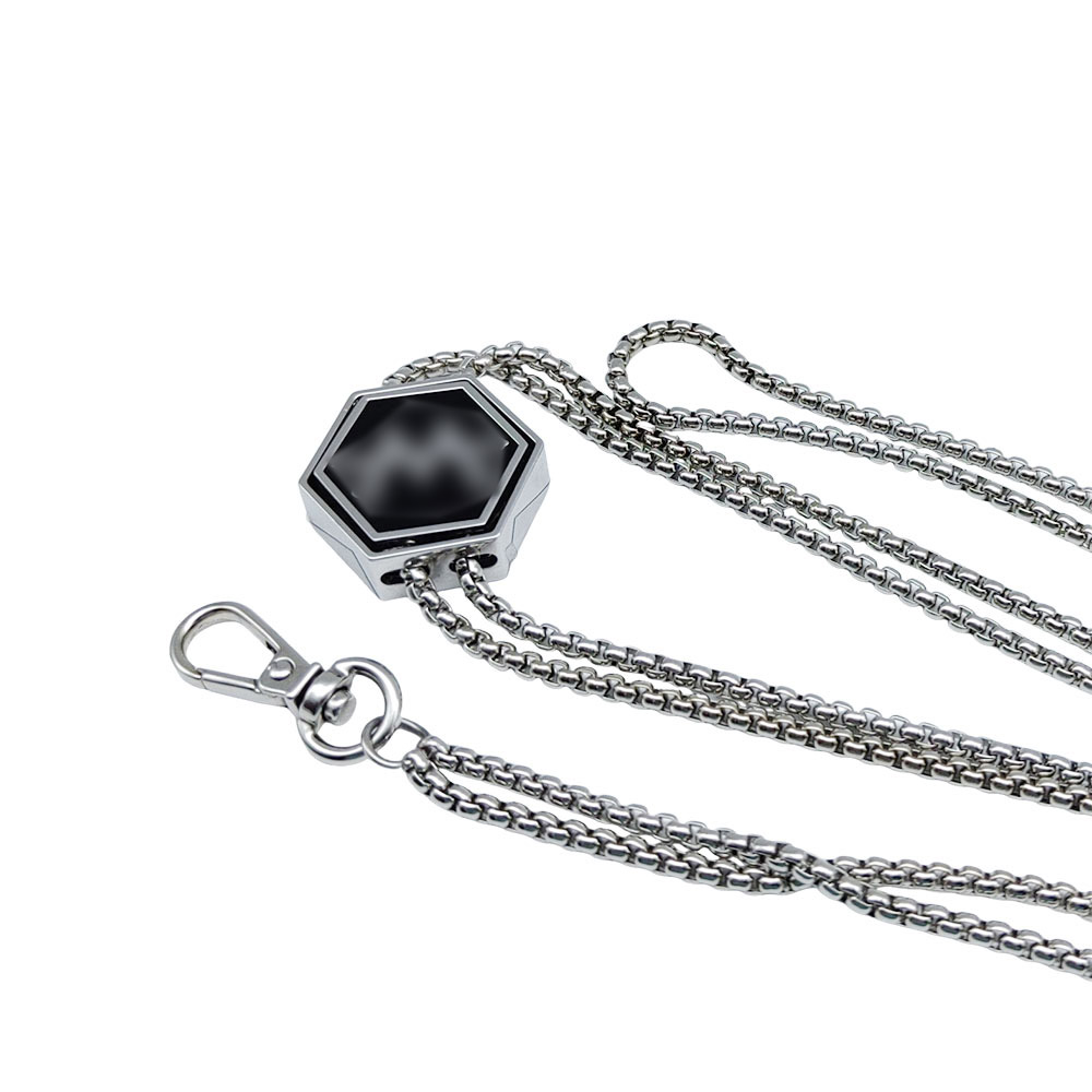 Close-up of the geometric slider pendant and metal end hardware on a silver chain