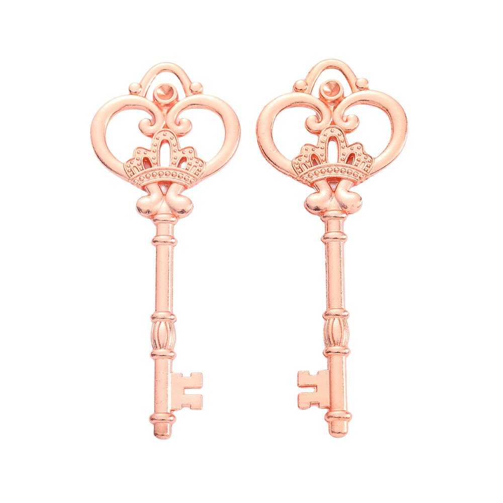 Pair of rose gold zinc alloy keys with ornate crown and heart bow design