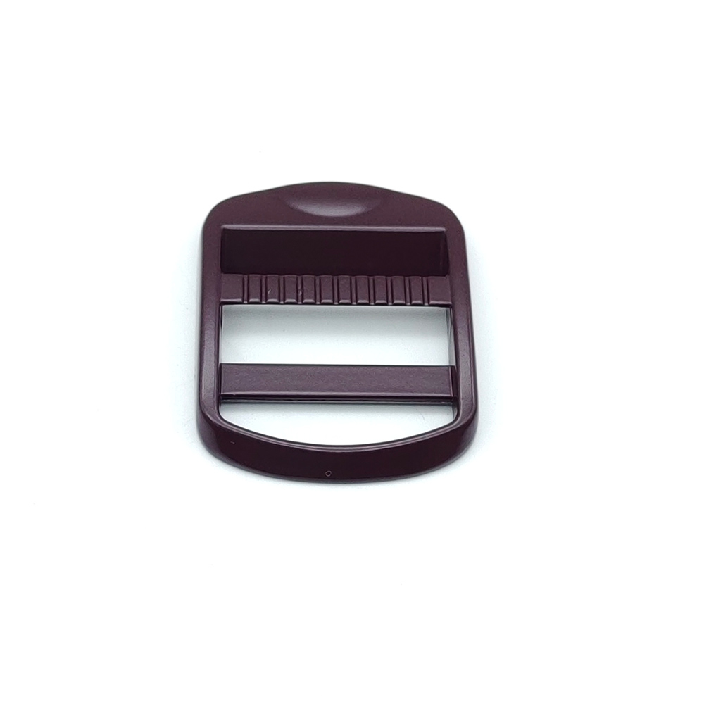Side profile of tension lock buckle in burgundy, illustrating low-profile height and rounded edges